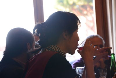 Portrait of friends drinking glass