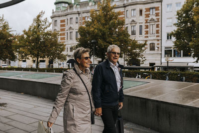 Senior couple walking in city