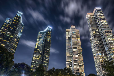 Illuminated buildings in city at night