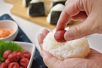 Midsection of person preparing food on table