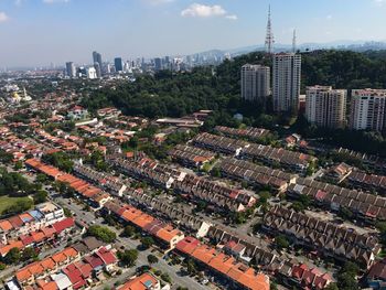 Aerial view of cityscape against sky