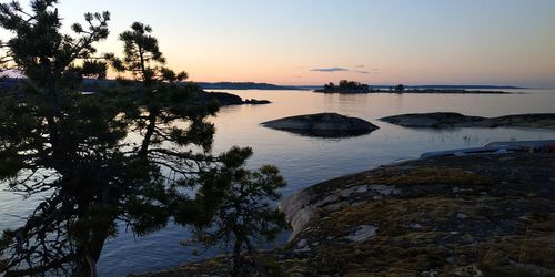 Scenic view of lake against sky during sunset