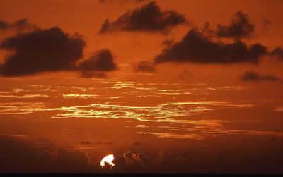 Scenic view of dramatic sky during sunset