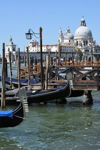 Boats moored in canal