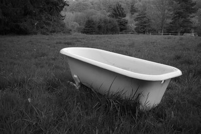 Abandoned boat on field