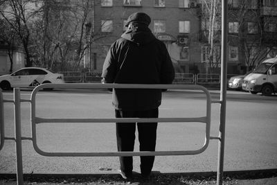 Full length of man standing on street in city