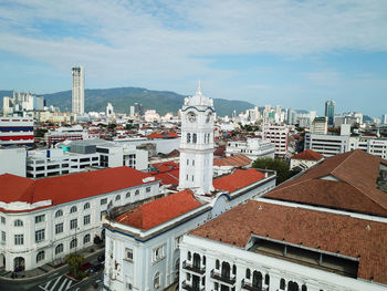 Panoramic view of buildings in city against sky