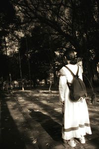 Rear view of couple standing in park
