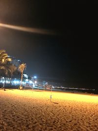 Scenic view of beach against sky at night