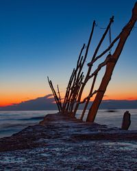 Scenic view of sea against clear sky during sunset