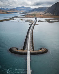 Aerial view of road over lake 