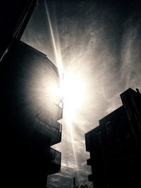 Low angle view of silhouette buildings against sky during sunset