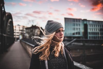 Close-up of woman standing against sky