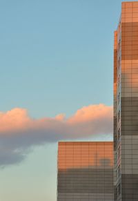 Low angle view of building against sky during sunset