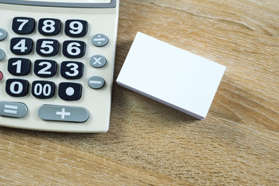 High angle view of smart phone on table