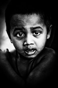 Close-up portrait of shirtless boy