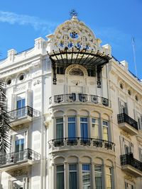 Low angle view of building against blue sky