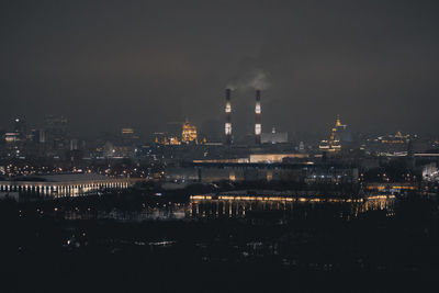 Illuminated buildings in city at night