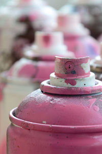 Close-up of pink spray bottles