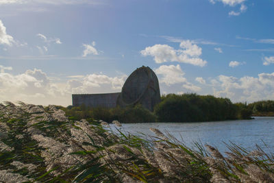 Scenic view of sea against cloudy sky