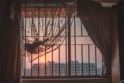 View of hanging from window at sunset