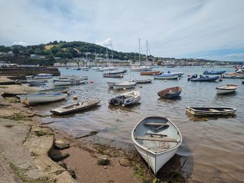 Boats moored at harbor