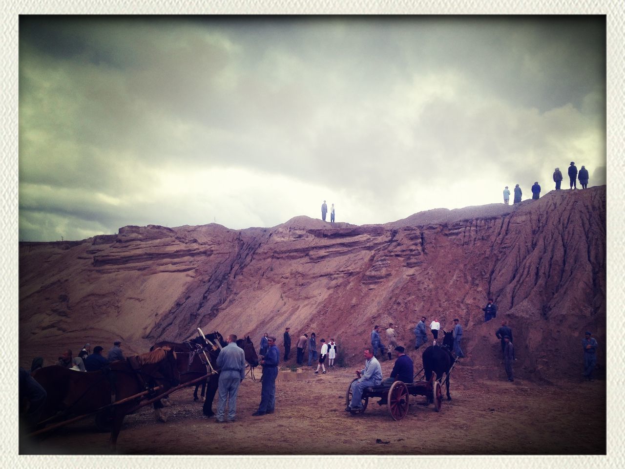 large group of people, transfer print, men, person, sky, lifestyles, auto post production filter, mountain, leisure activity, tourist, landscape, mixed age range, cloud - sky, walking, tourism, travel, day, travel destinations, built structure