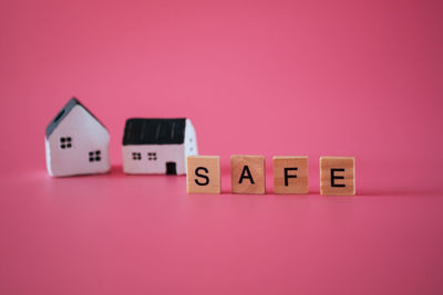 Close-up of toy over pink background