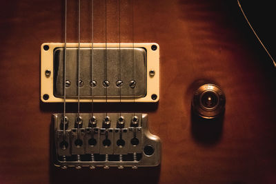 Close-up of guitar on table