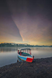 The boat rests with a beautiful view in the morning