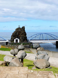 View of an animal on rock against sky