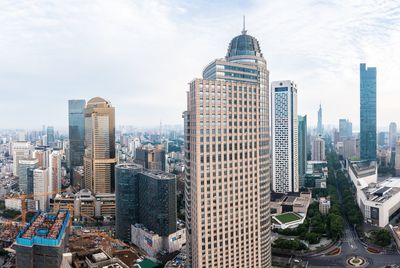Skyscrapers in city against sky