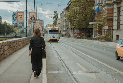 Rear view of woman on city street