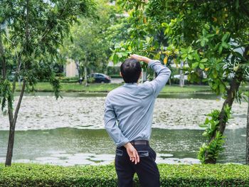 Rear view of a man standing in water