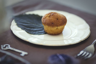 Close-up of cupcake in plate on table