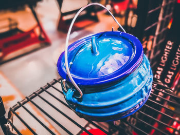 High angle view of blue glass on table