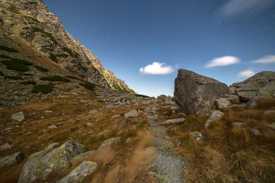 Scenic view of mountains against sky at night