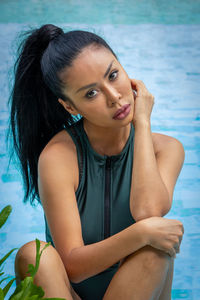 Portrait of young woman in swimming pool