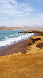 Scenic view of beach against sky