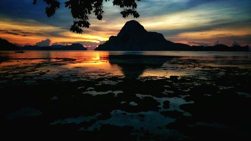 Reflection of clouds in water at sunset