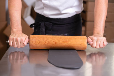 Midsection of woman working on table