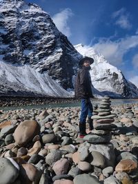 Full length of woman standing on rock