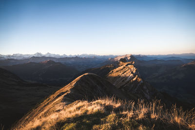 Scenic view of mountain range against clear sky