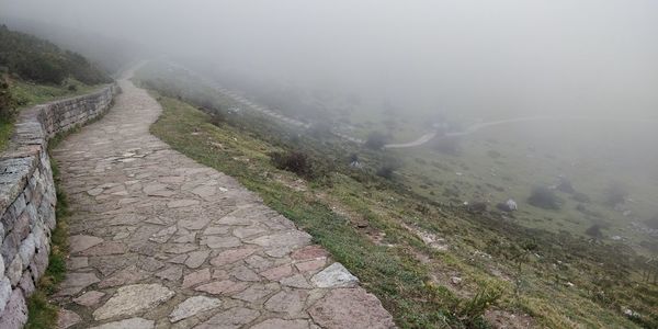 Scenic view of mountains during foggy weather