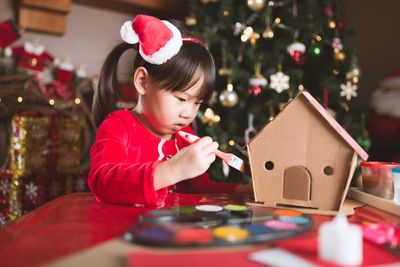 Boy holding christmas tree