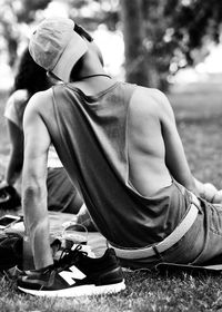 Midsection of boy sitting outdoors