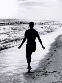 Rear view of man on beach