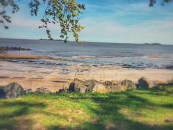 Scenic view of sea against cloudy sky