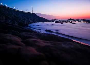 Scenic view of sea against sky at sunset