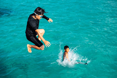 High angle view of man swimming in sea